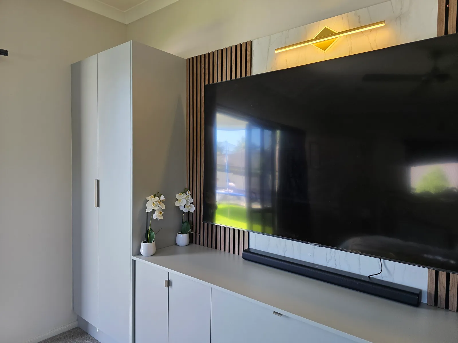 Media Wall with Timber Slats & Cabinetry