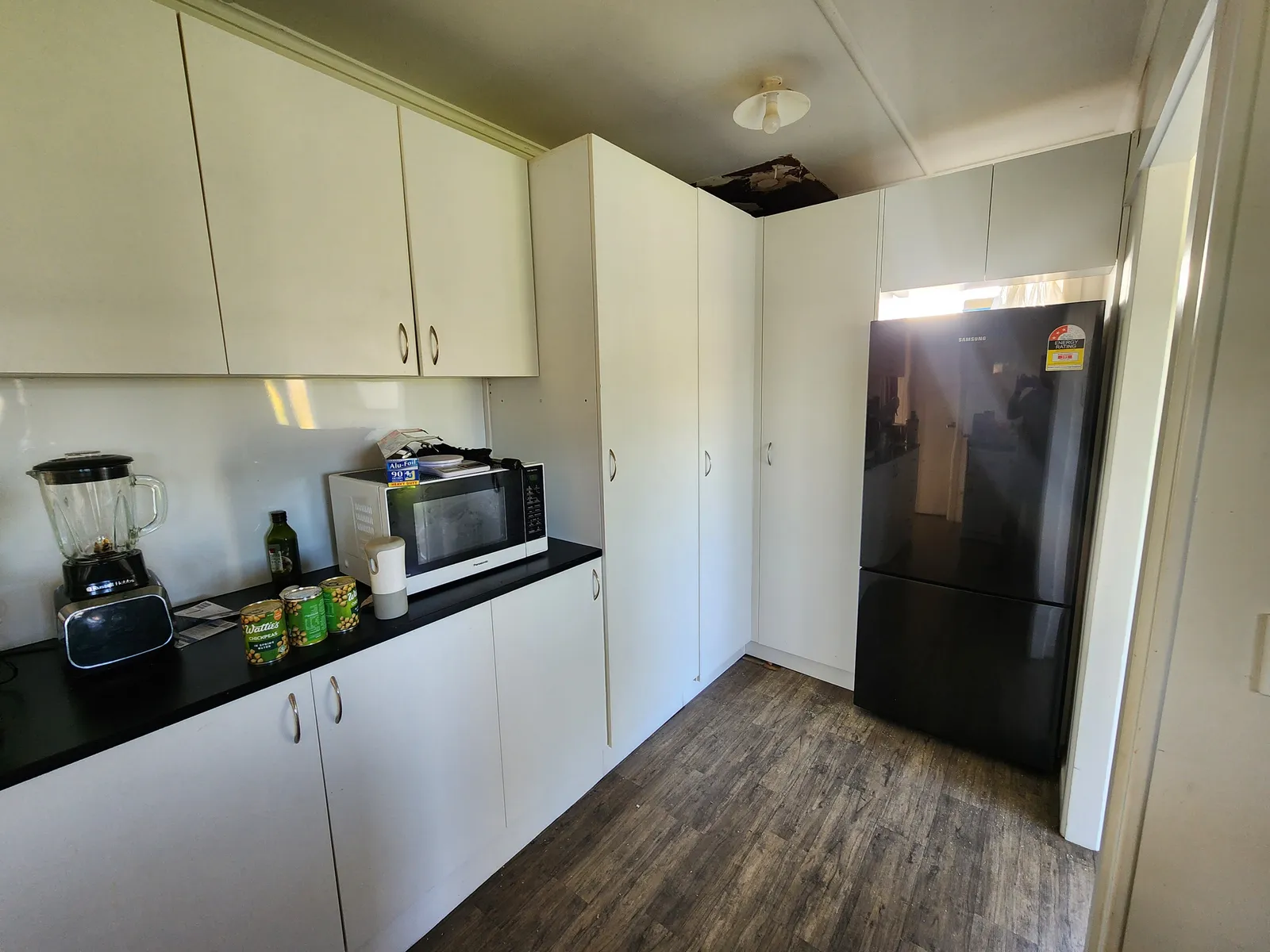 White Kitchen with Full-Height Pantry