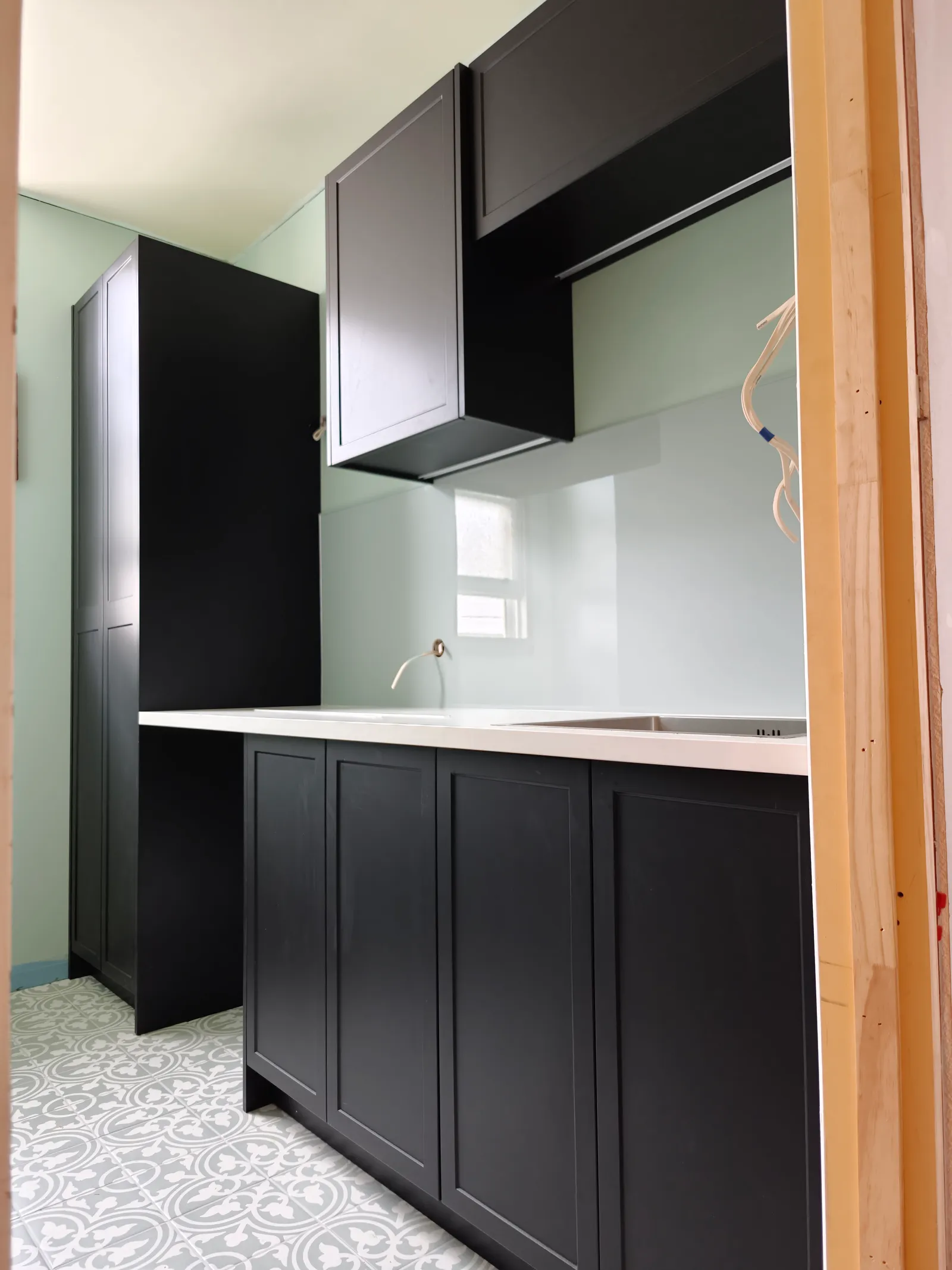 Black Shaker Kitchen with Patterned Tiles