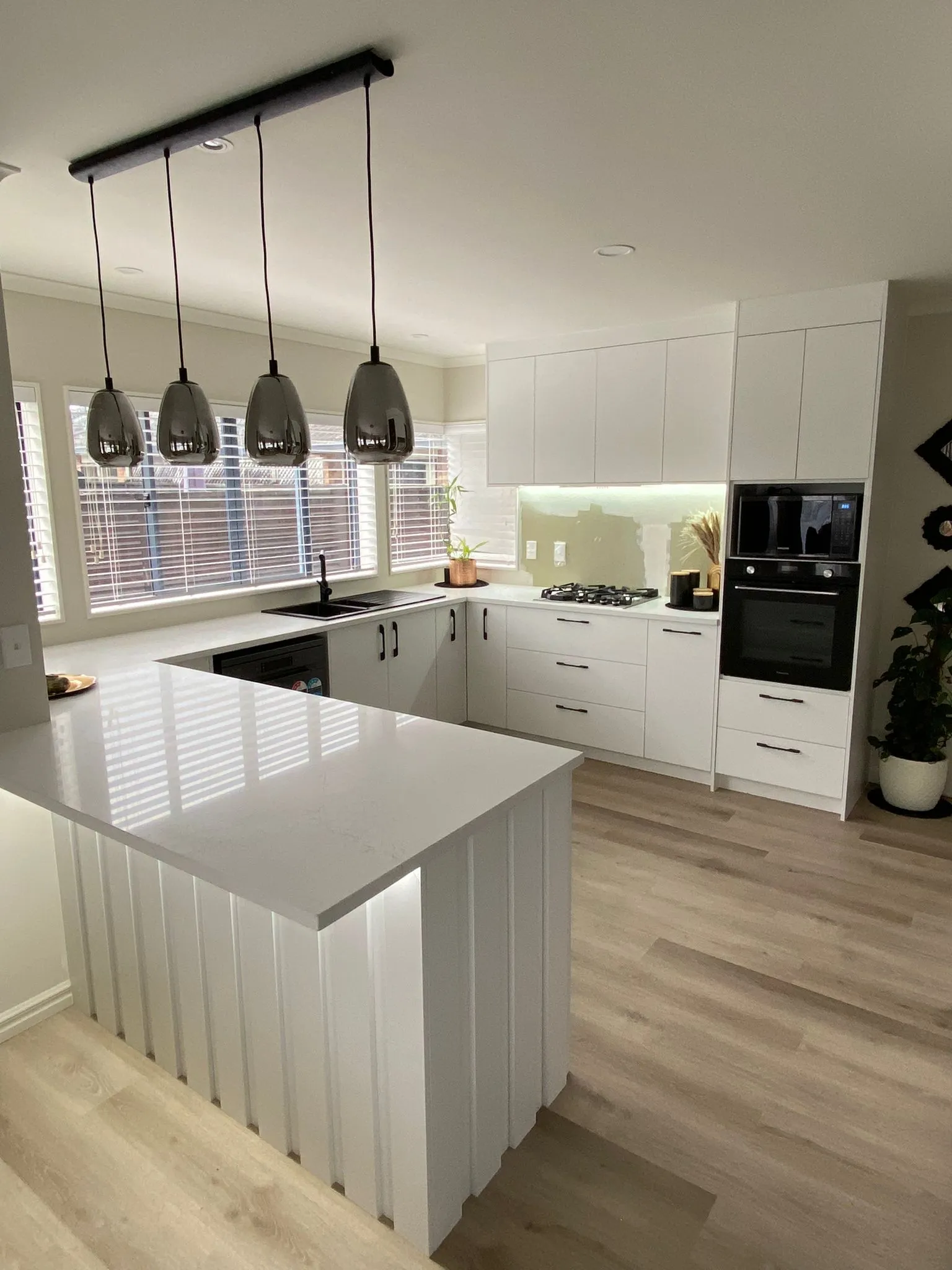 U-Shaped Kitchen with Waterfall Peninsula